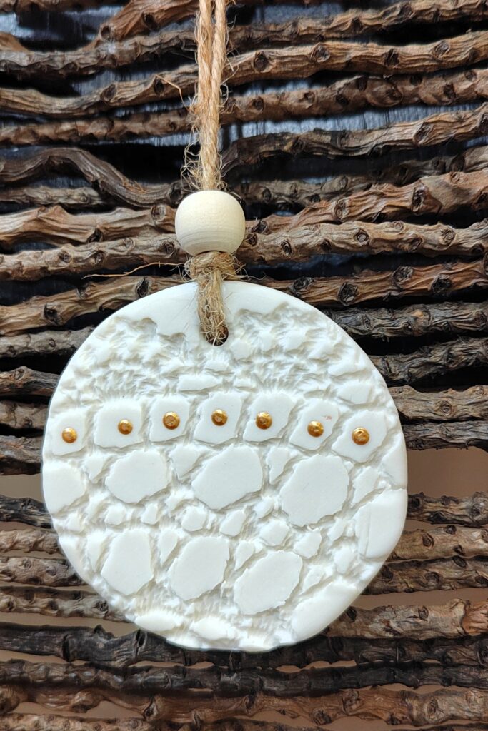 Suspension pour sapin, Poussière d'Argile